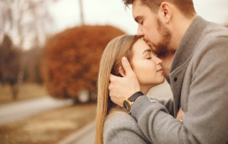 Loving couple kissing in park